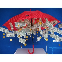 Un parapluie s\'ouvrant sur une pluie de billets